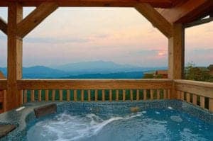 hot tub on the deck of a smoky mountain cabin