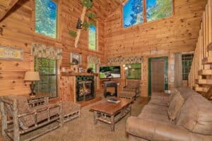 living room with fireplace inside Black Bear Creek Cabin