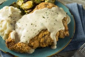 country fried steak with gravy and mashed potatoes