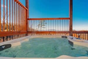 hot tub on deck of a cabin