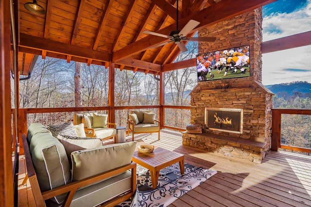 cabin deck with fireplace during winter
